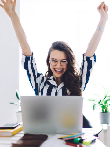 Working Women with Arms Raised