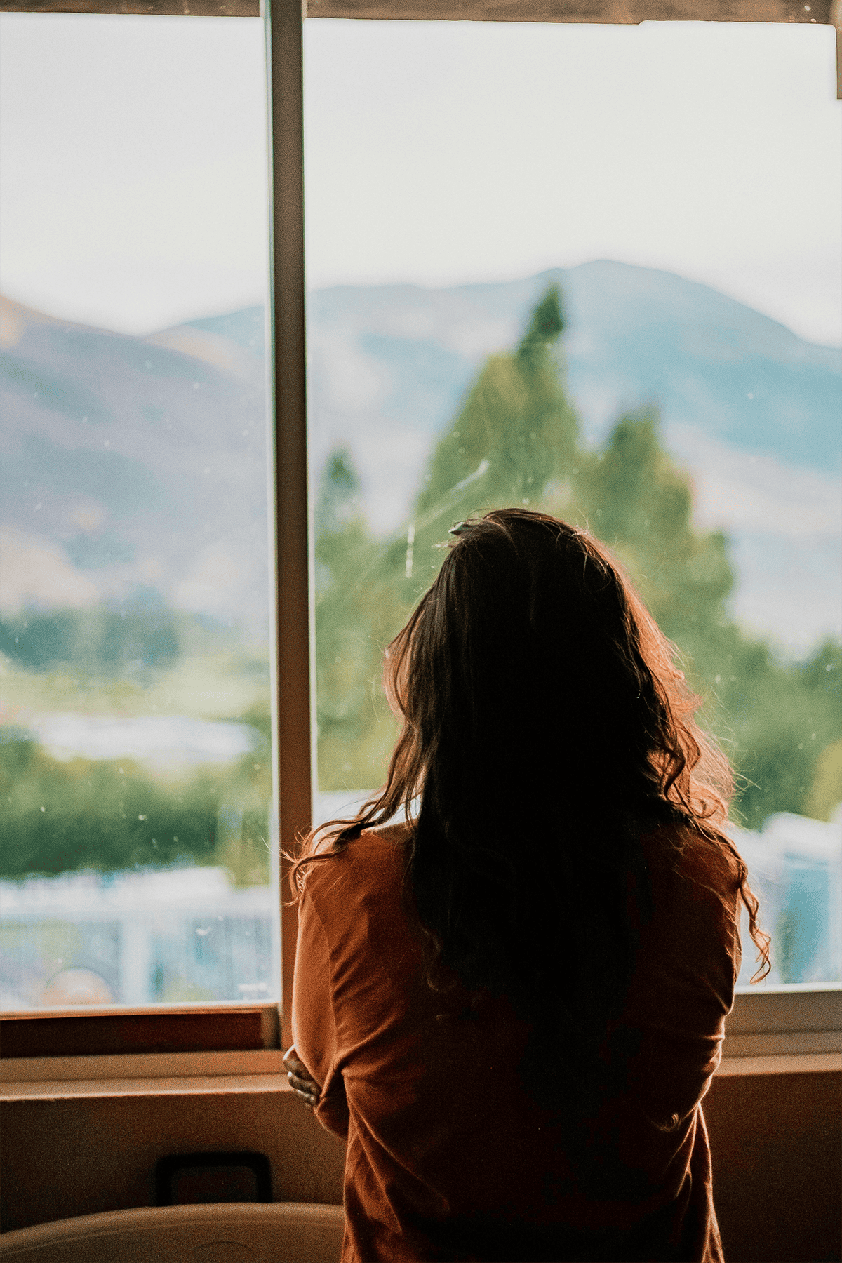 Woman standing in front of window