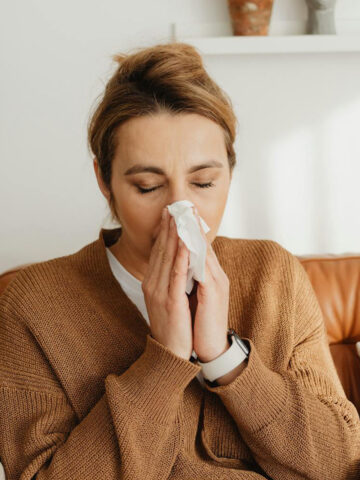 woman sneezing