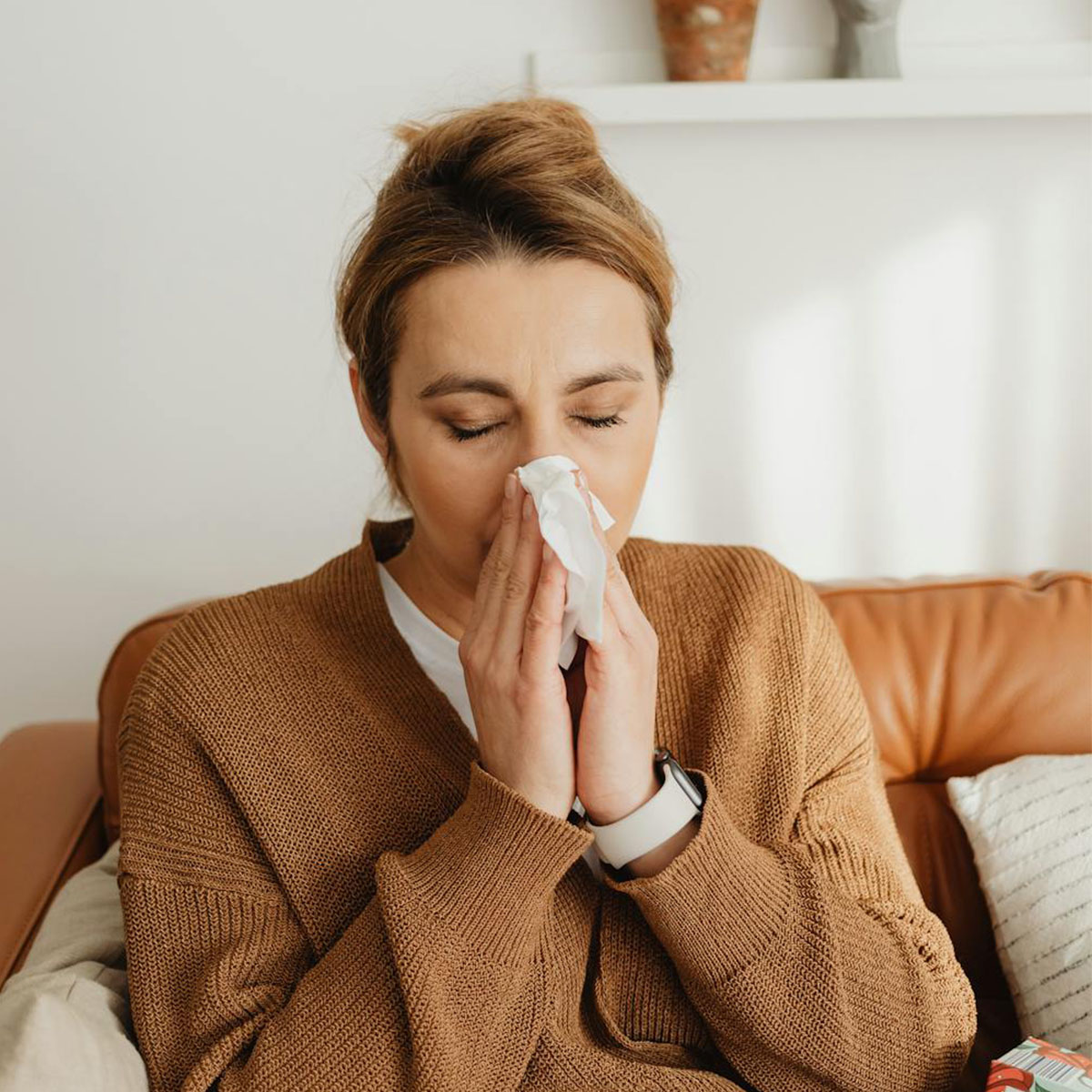 woman sneezing